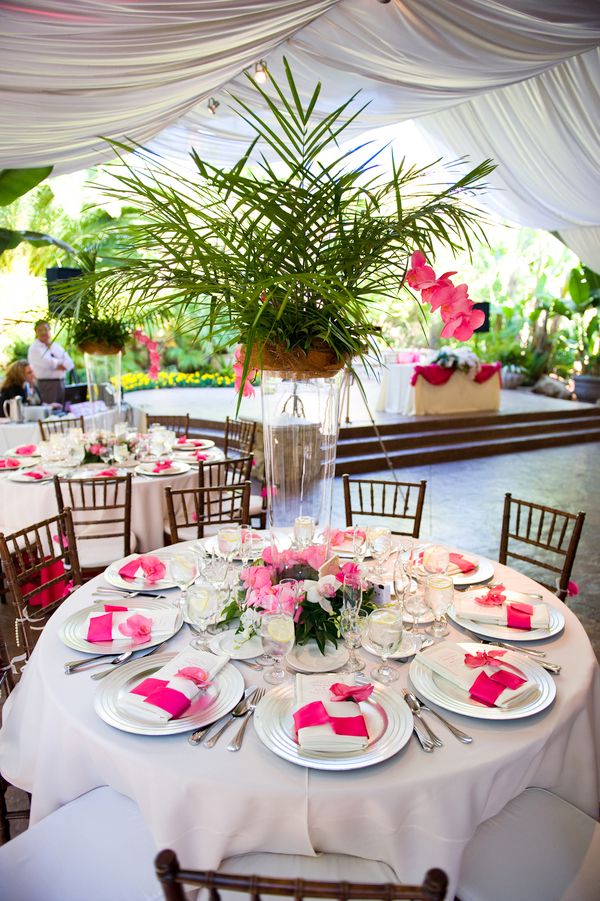 Tented reception table with pink floral accents